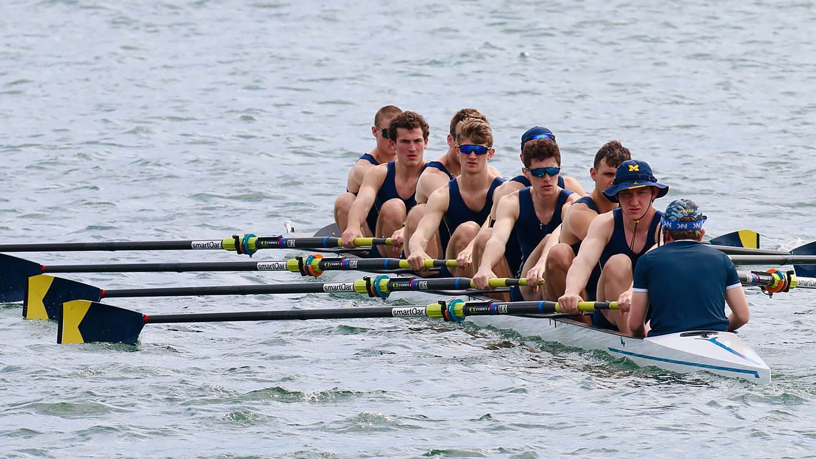 A group of men rowing.