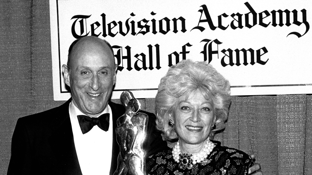 John and Patricia Mitchell accepting a cinematic arts award.