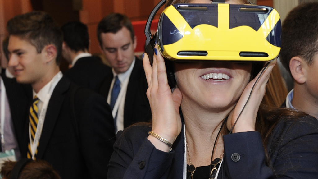 Smiling woman wearing a virtual reality headset.