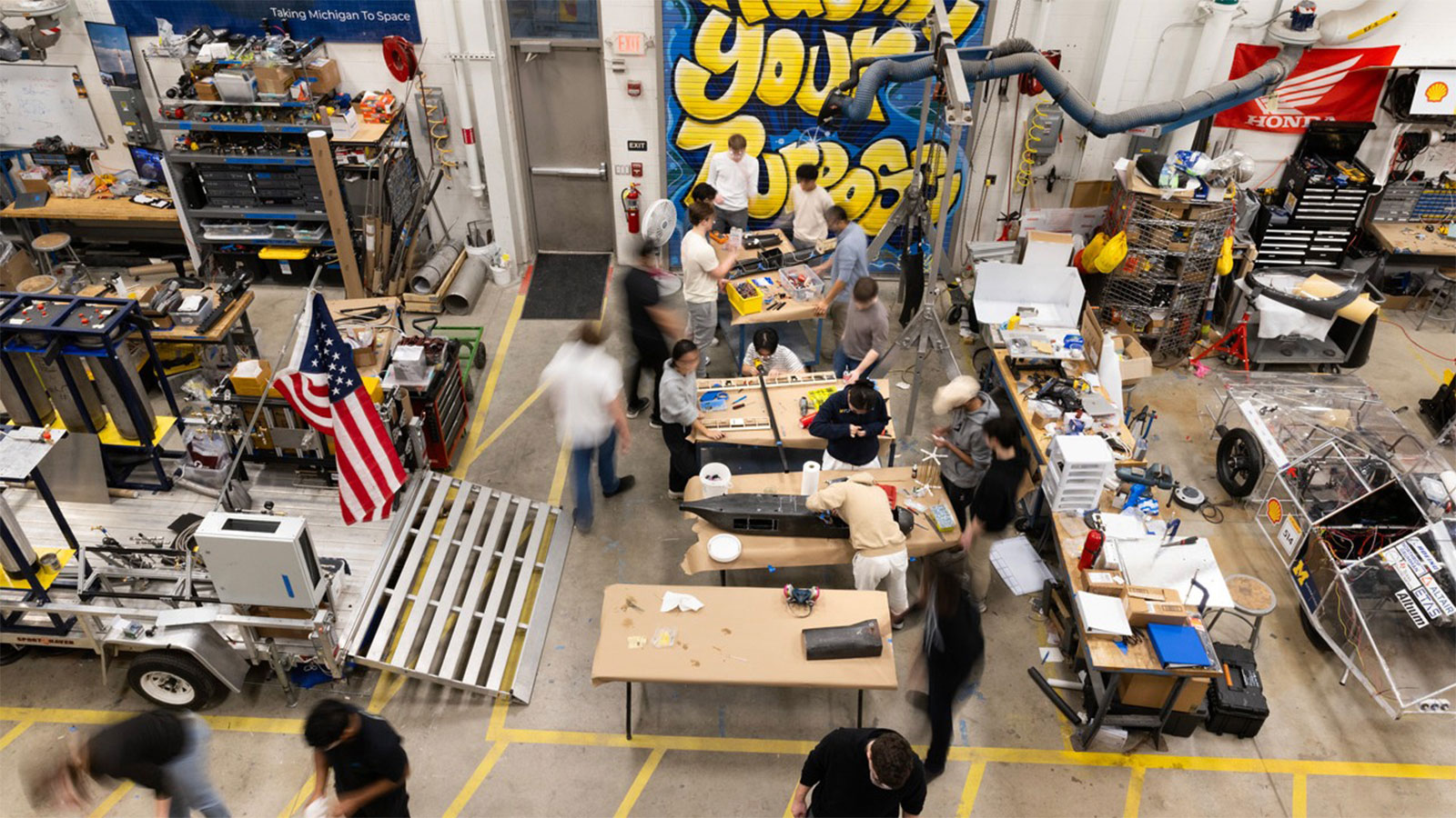 A long exposure photograph showing students working in the Wilson Center.