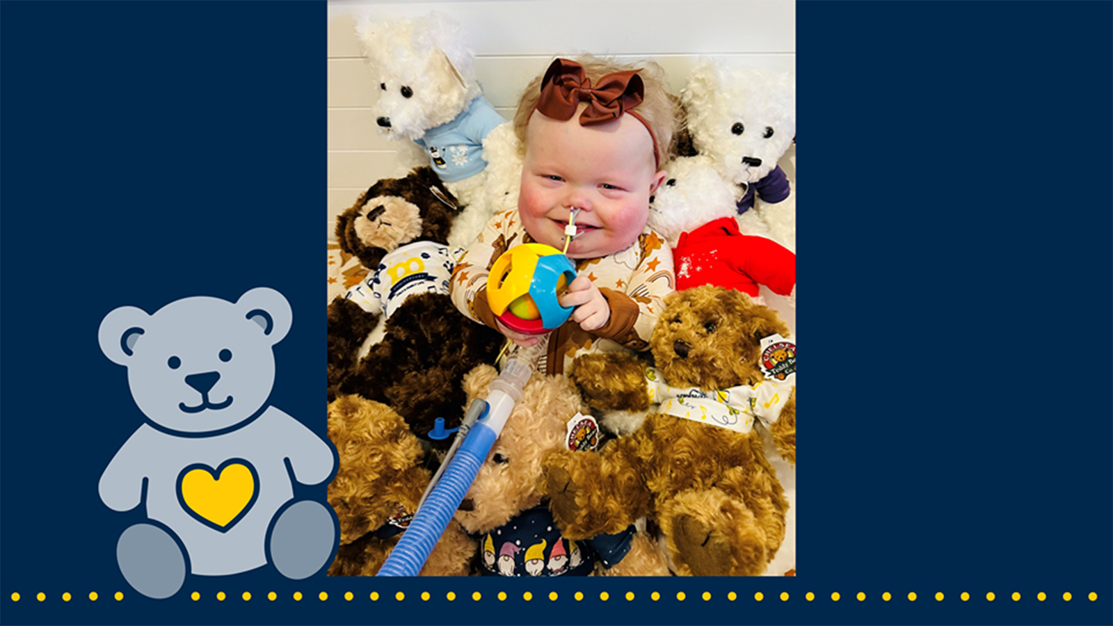 A baby with a nasal cannula smiles while sitting among teddy bears