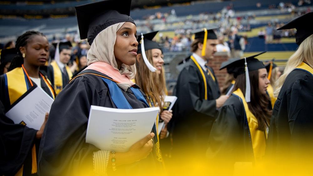 Graduating University of Michigan students in caps and gowns.