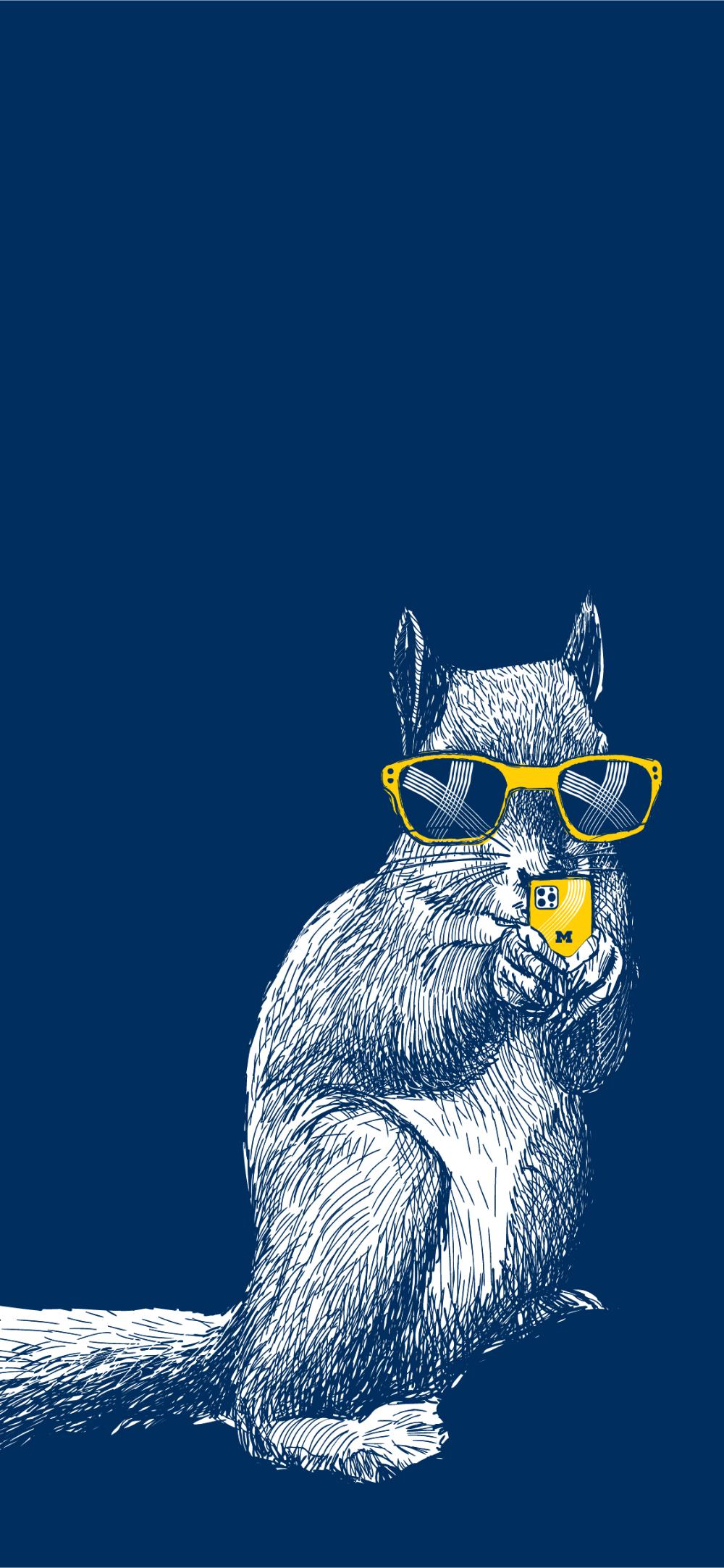 A squirrel in sunglasses holding a smartphone branded with the U-M block M.