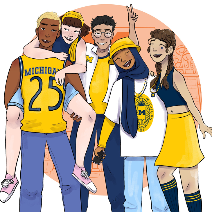 A group of students in Michigan apparel pose together.