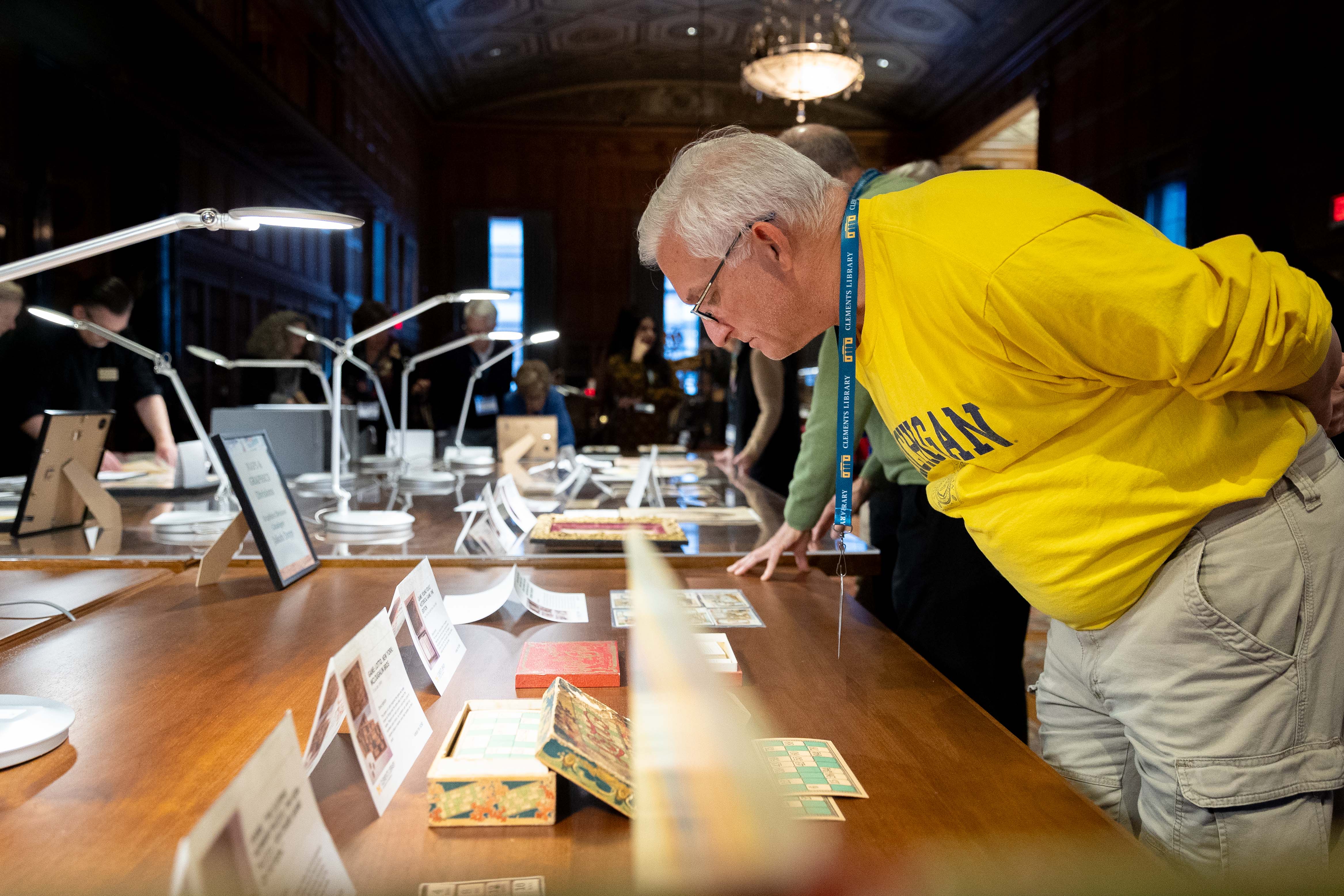 A guest looking closely at materials on display.