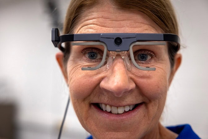 A close up of Wendy Carender wearing eye-tracking glasses.