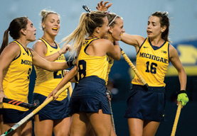 U‑M Women's Field Hockey players celebrating.