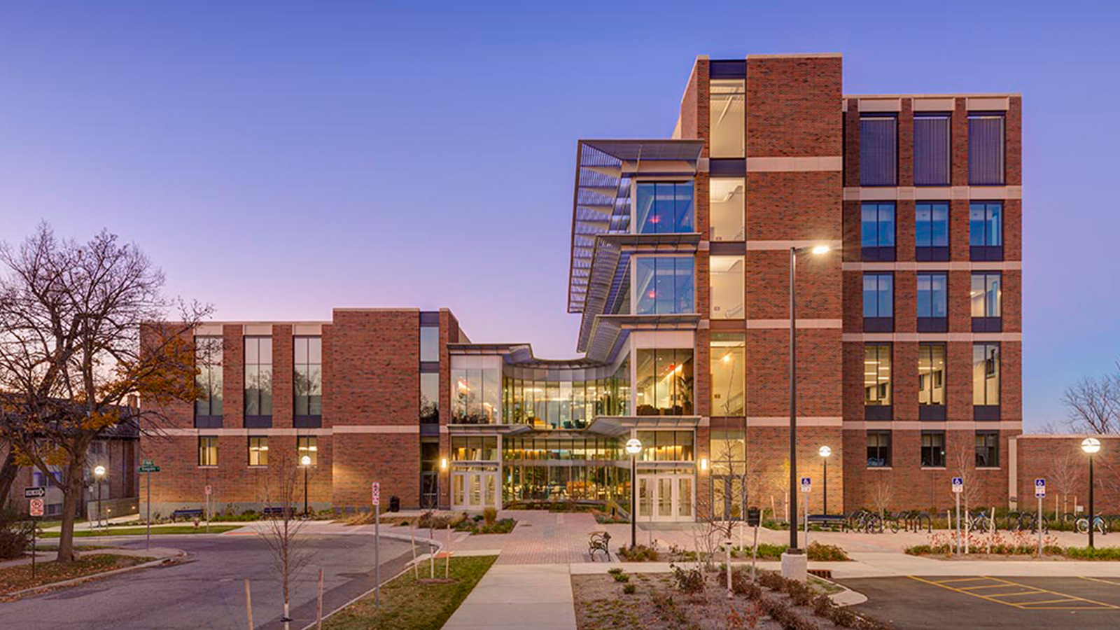 Exterior of the University of Michigan School of Nursing building at dusk.