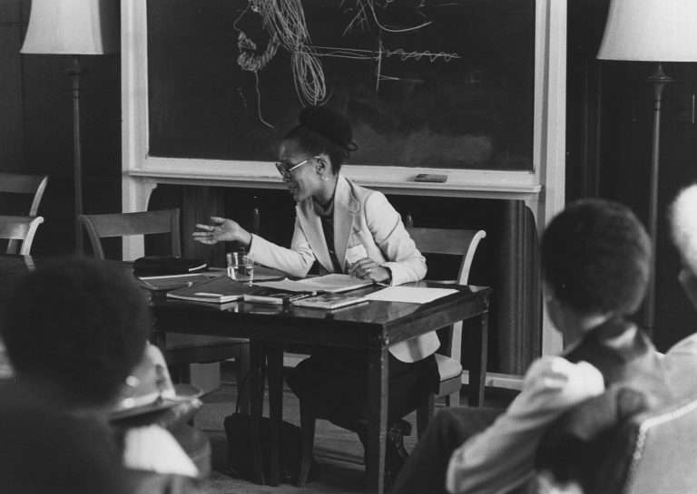 A speaker presenting at one of the “Black Women in Transition” Conferences.