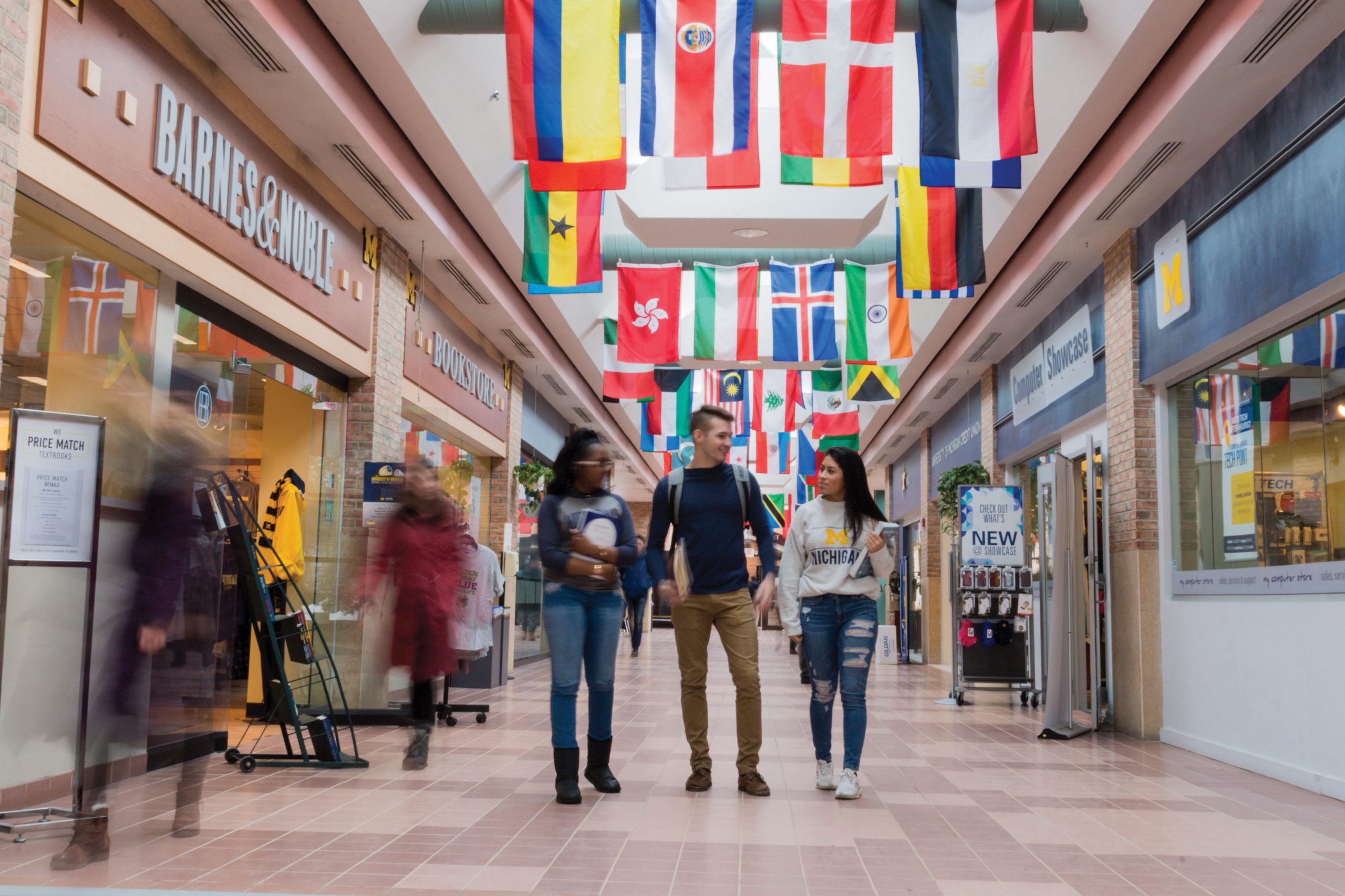 Students walking through a university building.