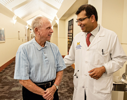 A doctor conversing with a patient.