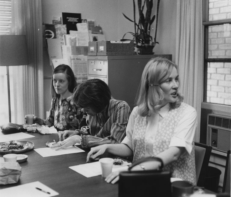 Three women sitting around a table at an early CEW+ sponsored discussion.