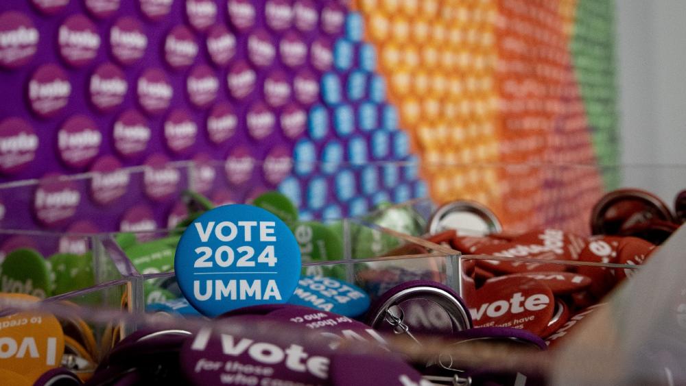 A display of colorful buttons that say "Vote 2024 UMMA".