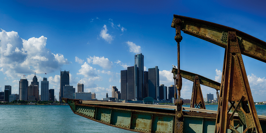 Panoramic view of Detroit city skyline taken at daylight from Windsor, Ontario during the summer.