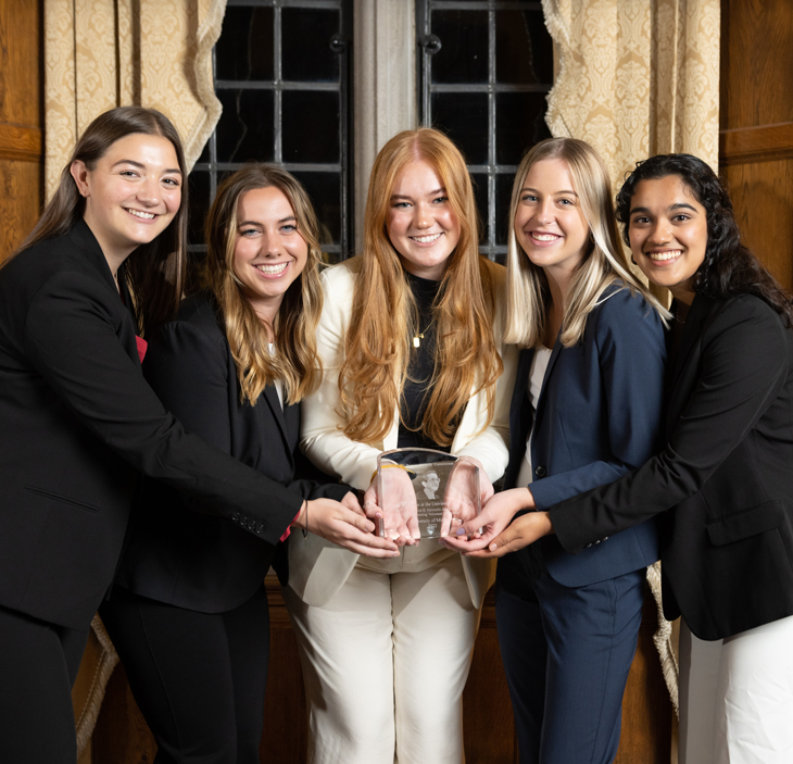 Members of the DMUM posing with the Hermelin Award.