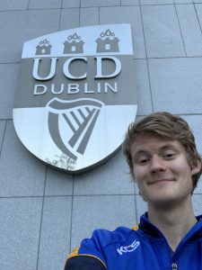 Easton in front of a university building in Ireland.