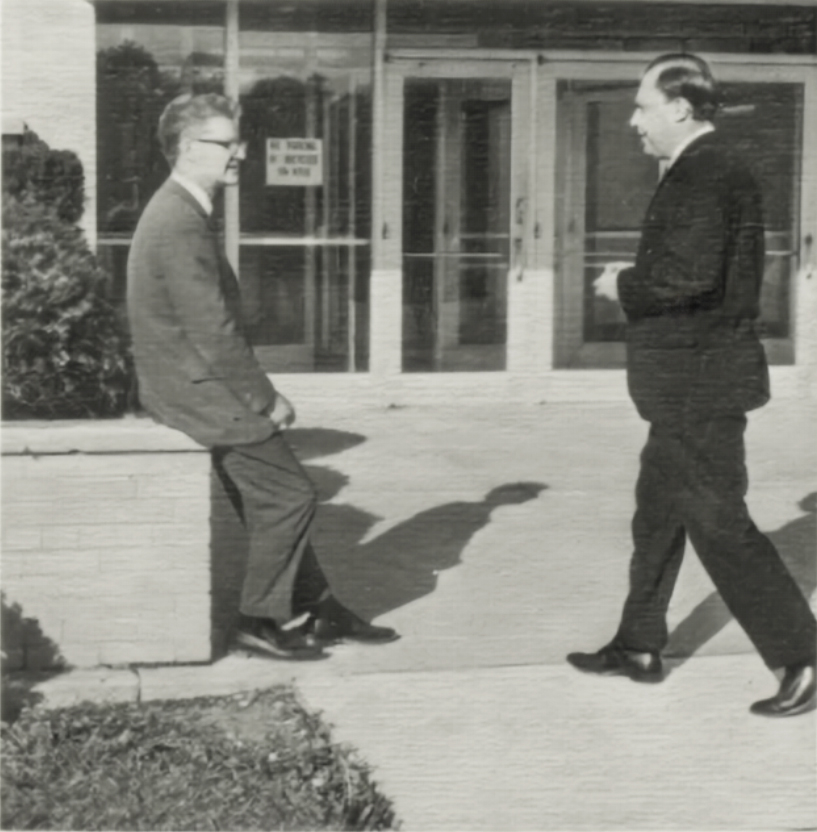 A black and white photo of a page from the 1968 UM-Flint yearbook with Lubomyr Kowal along with the chair of the economics department.