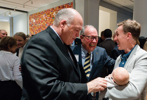 May introduces Jim Hackett to his son and granddaughter.