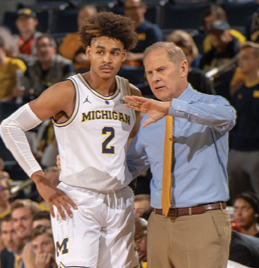 The University of Michigan men's basketball team plays host to Northwood University at Crisler Arena in Ann Arbor on Nov. 2, 2018; Coach John Beilein and a player.