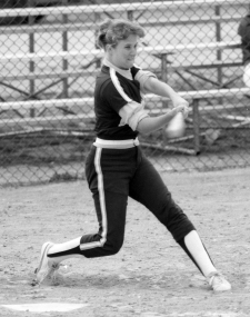 Mary Petrovich batting during a game of softball while attending U‑M.