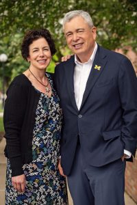 Regent Ron Weiser and his daughter, Elizabeth Weiser Caswell, standing outside.