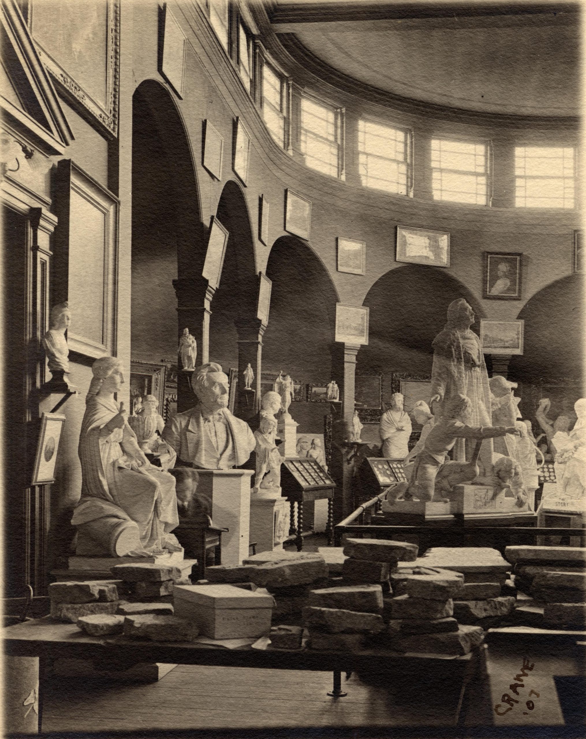 A black and white image of the statues within the art gallery. 