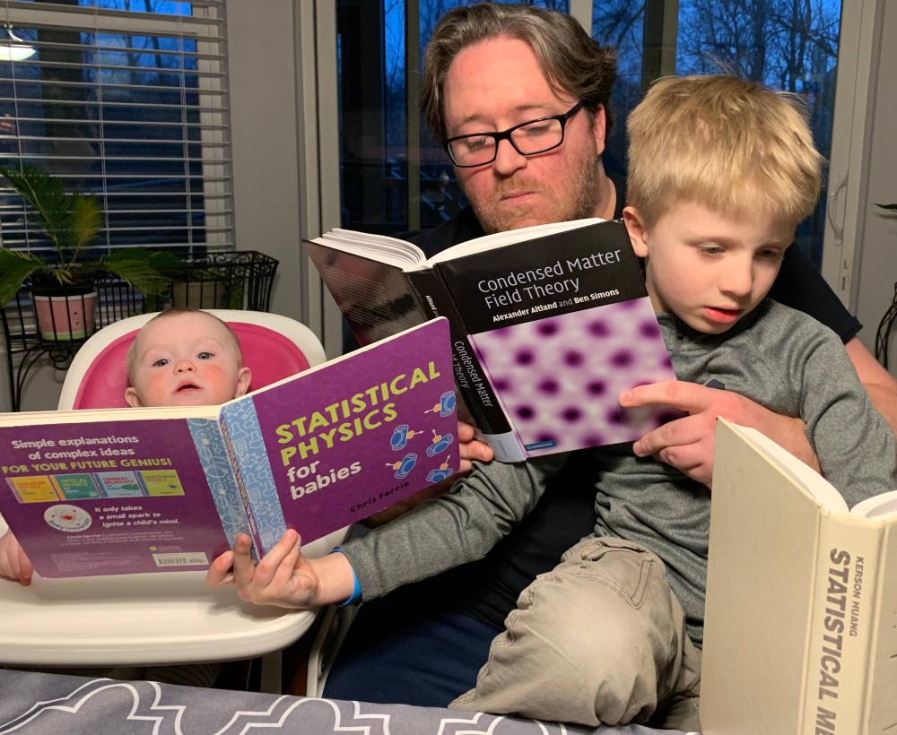 Kevin, Sam and Emily reading. 