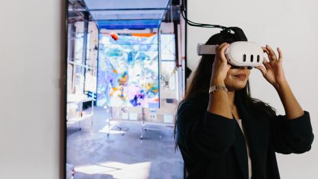 Taubman college student using Extended Reality 3D headset in the Taubman Visualization Lab (TVLab)