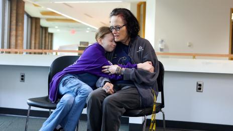 Mom and daughter hugging