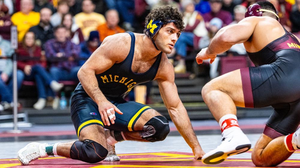 A Michigan wrestler prepares for the next move. 