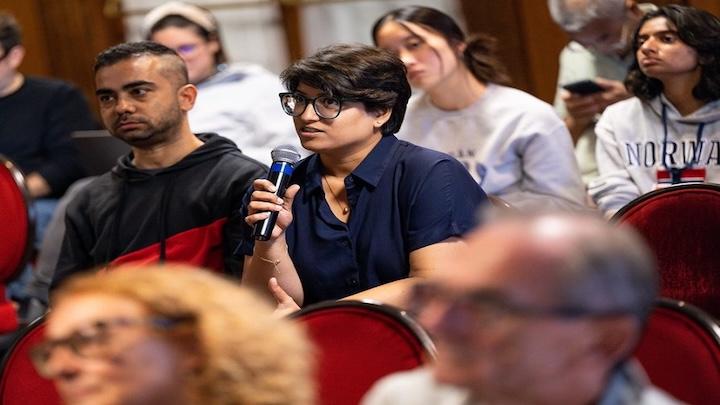 Student speaking into microphone  