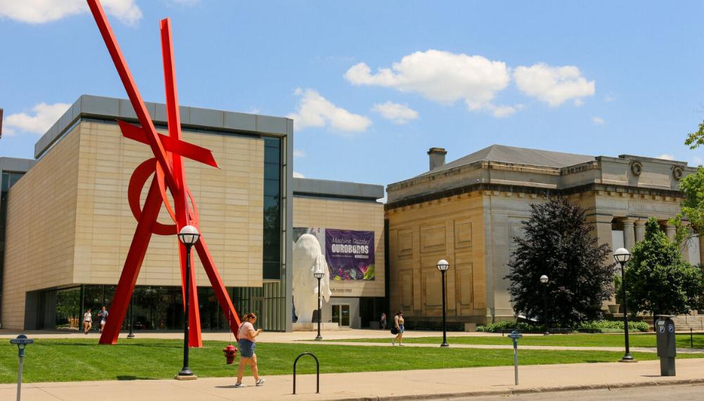Streetview of the outside of UMMA. Specifically showcasing the Orion, a giant steel statue by artist Mark de Suvero, and Jaume Plensa's 