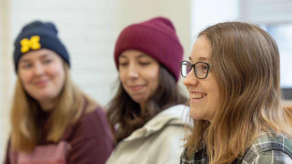 Three NextGen students having discussion 
