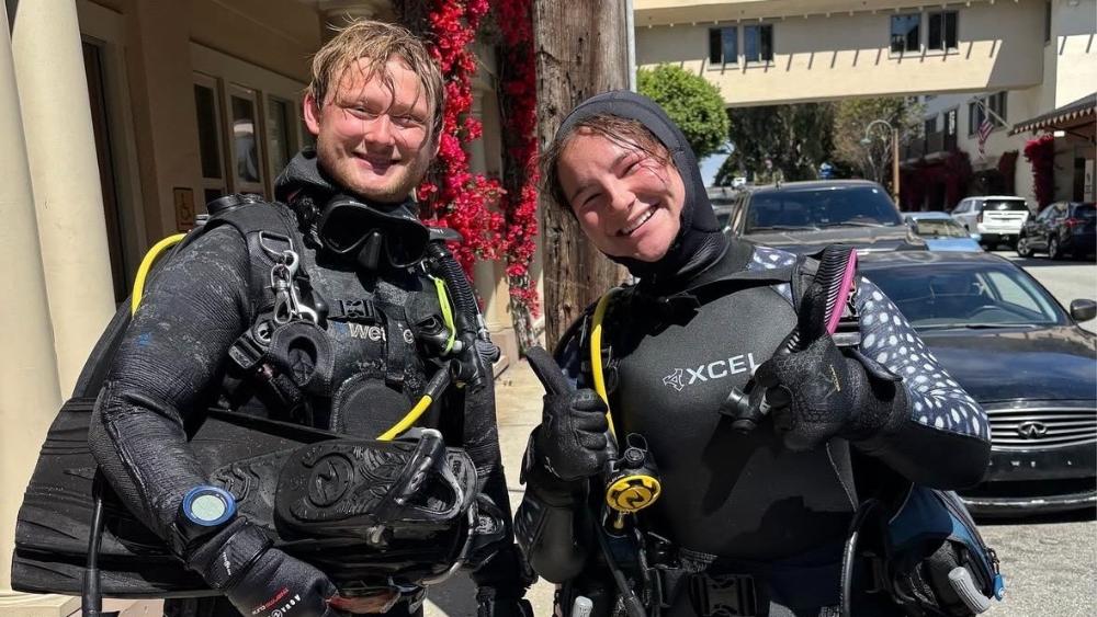 Students in diving gear smiling
