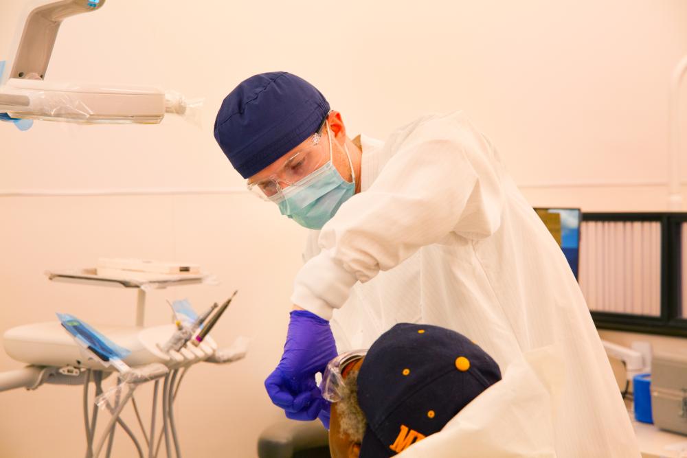 School of Dentistry student working with patient in clinic 