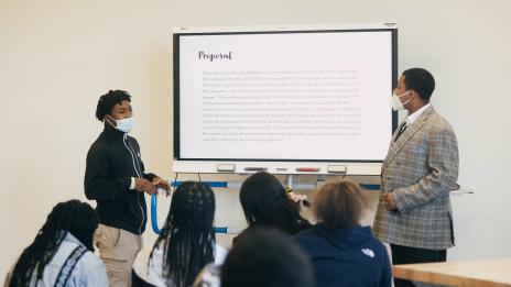 Two students at Marygrove Highschool presenting to classmates