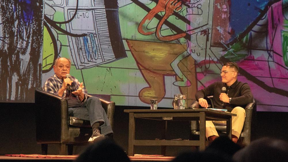 Artist Cheech Marin and Stamps Dean Carlos Francisco Jackson on the stage of the Michigan Theater