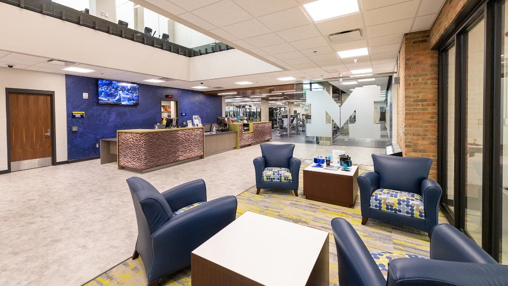 North Campus Recreation Building lobby, check in desk, and weight room