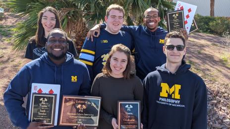 The Michigan Debate team posing with their awards 