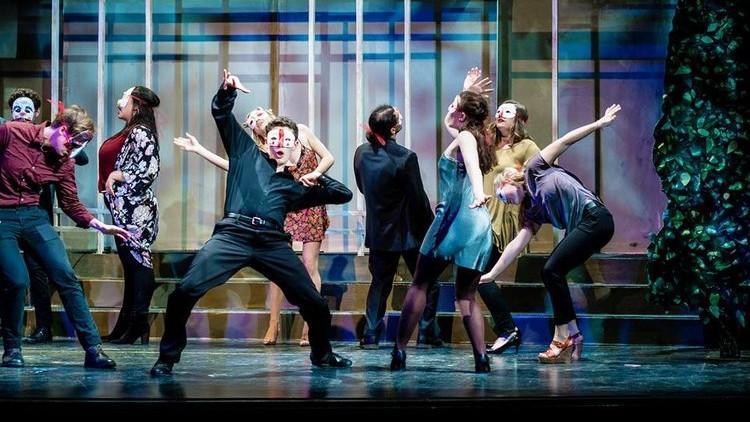 Students onstage during a performance of Much Ado About Nothing 