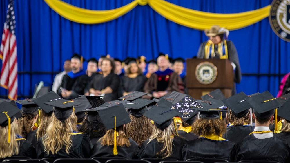 SEAS graduates hats at graduation ceremony