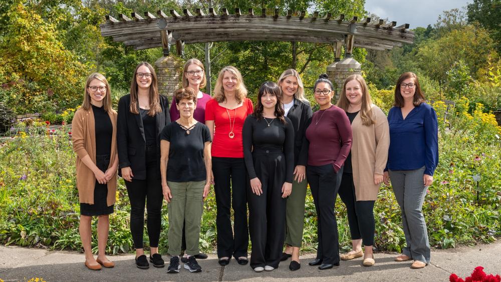 A group of University of Michigan Aphasia Program staff members standing outside