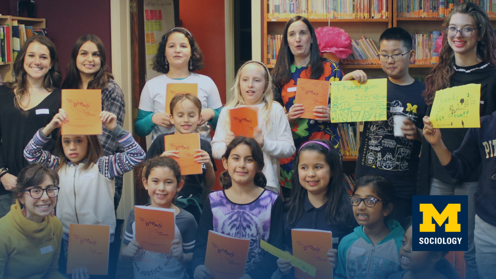 Young learners pose in library