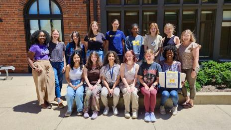 The 2024 Summer Scholars with Dr. Meaghan Pearson outside of Mosher Jordan Hall. Summer Scholars Presentation: The 2024 Summer Scholars stand together in attendance at their final research presentation at Palmer Commons.