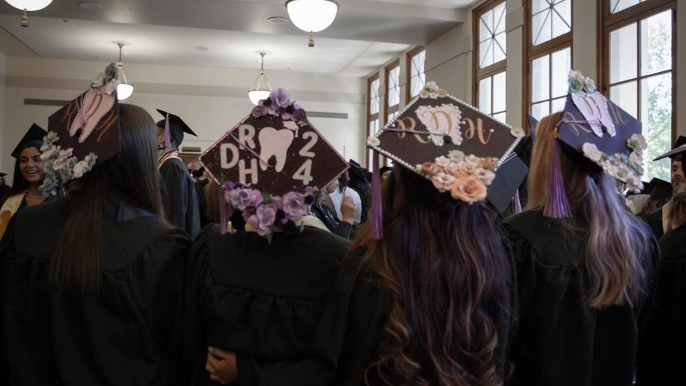 Dental Hygiene Students with 2024 Caps and Gowns on for Graduation